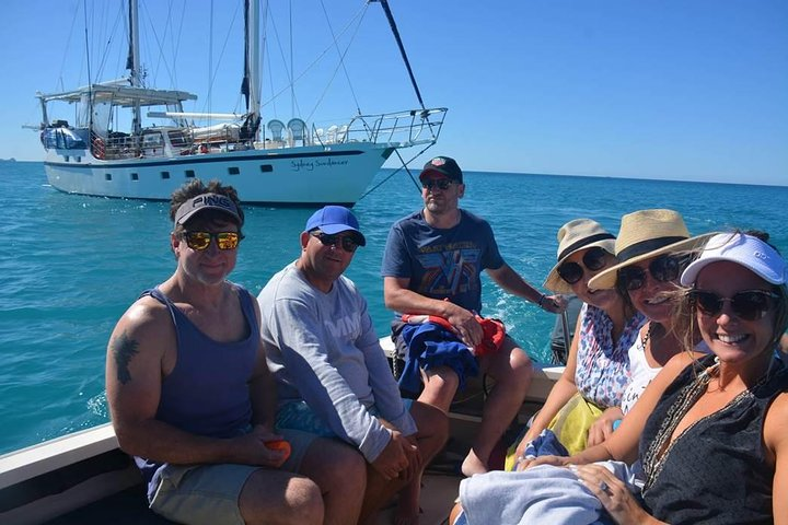 Guests departing from yacht in dive tender for a shore excursion