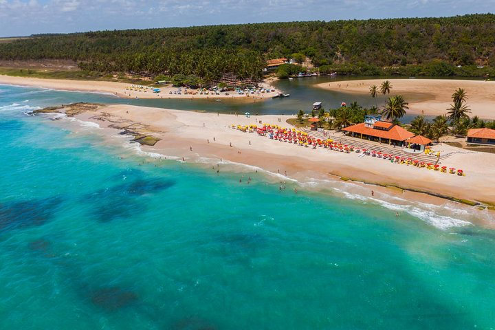 Sink your toes in the protected white sand beach