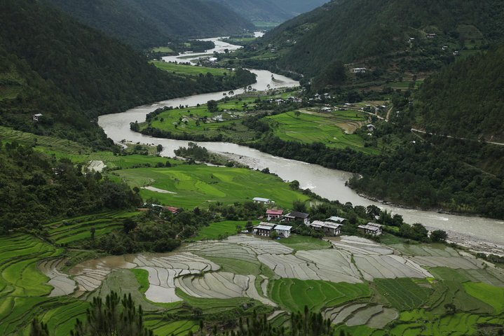 The fertile Punakha valley with Mochu River meandering through the village as seen from the picturesque Khamzum Yuellay Namgyel Chorten