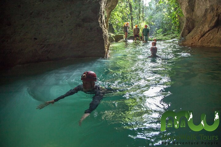 Swimming into the entrance of the ATM Cave