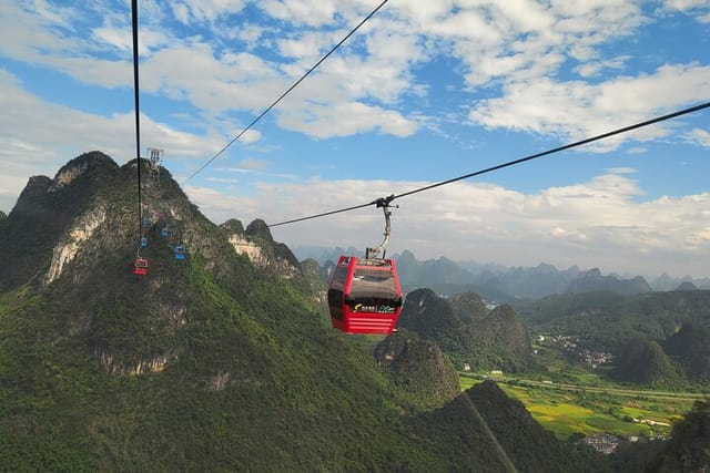 1-Day Tour: Yangshuo Yulong Bamboo Boat and Ruyi Peak Cable Car - Photo 1 of 16