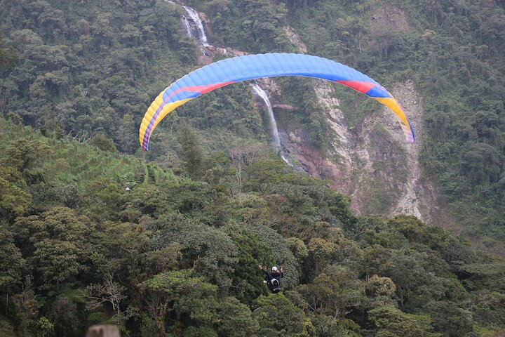 Paragliding flight over a valley of mountains and waterfalls + video - Photo 1 of 8