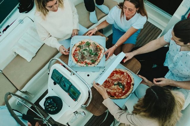 Checking out the delicious pizza on the boat