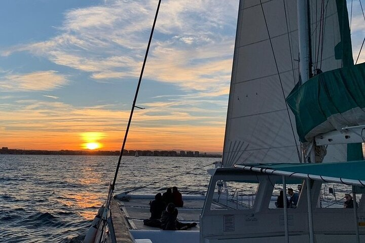 Sailing catamaran sailing in the sunset