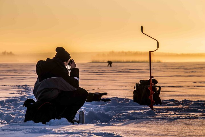 Ice Fishing on a Frozen Lake in Levi - Photo 1 of 6