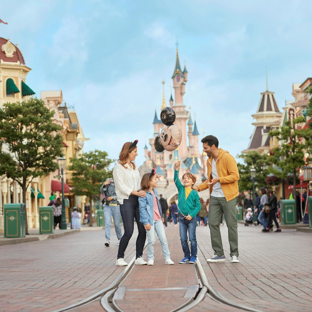 Step into a world of joy where families create unforgettable memories surrounded by charming architecture and whimsical attractions all just a train ride from Paris.