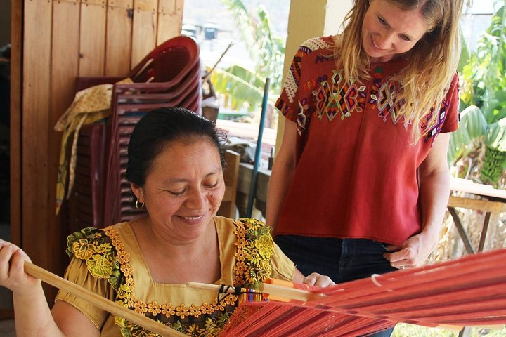 Lola demonstrating the ancient craft of traditional Maya backstrap weaving.