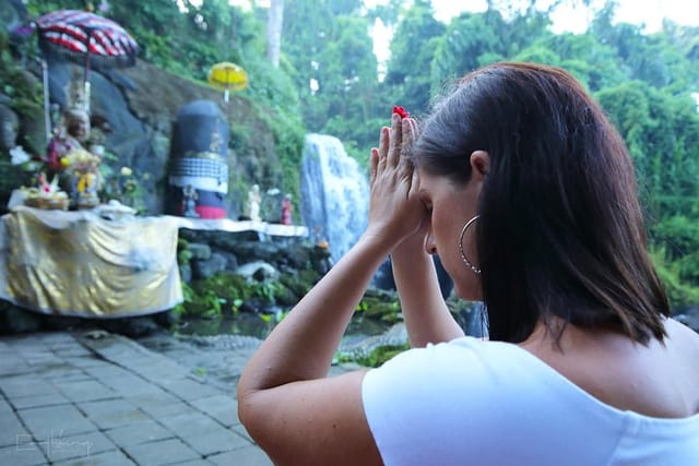 Experience a traditional Hindu blessing at a sacred Holy Water site. 