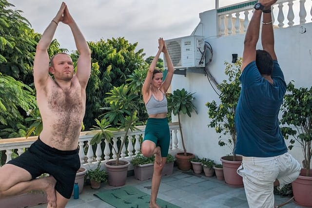 Yoga at rooftop with travellers