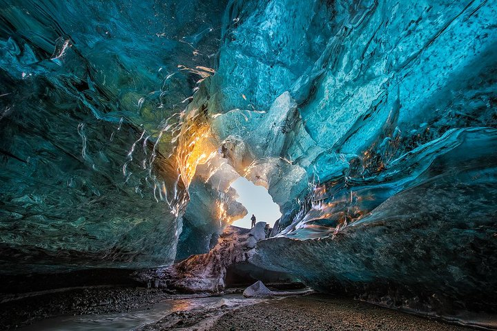 Natural ice cave during sunset