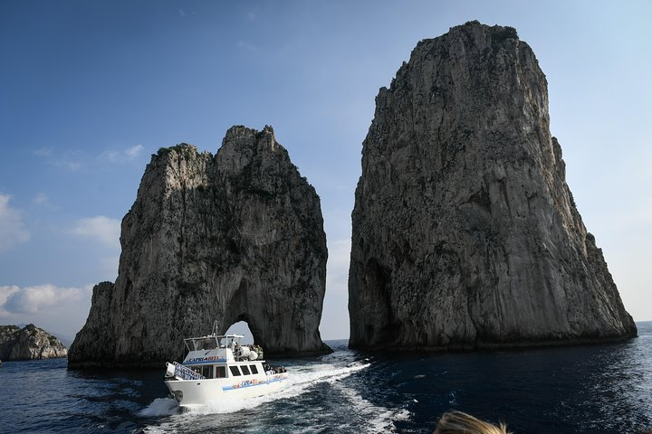 Faraglioni rocks and our boat