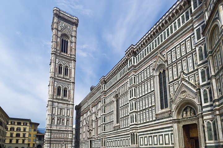 Marvel at the stunning architecture of Giotto's Bell Tower and Cathedral where the intricate designs and breathtaking views create an unforgettable experience in the heart of Florence.