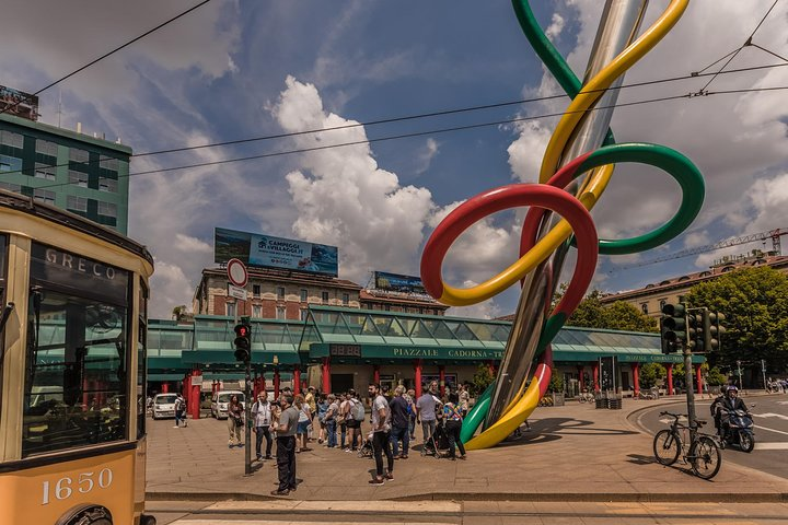 Experience the charm of Milan as you stroll past striking landmarks vibrant sculptures and bustling crowds immersing yourself in a rich tapestry of history and culture.