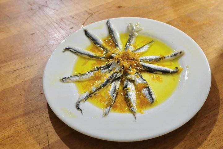 Anchovies marinated in an orange sauce