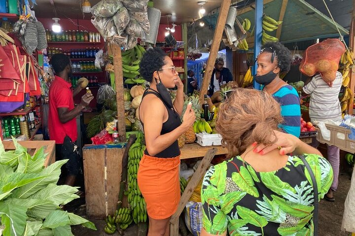 Visiting the local market, trying tropical fruits!!