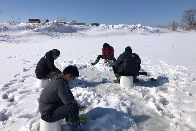  Ice fishing for smelt and visiting traditional sweet shops. - Photo 1 of 5