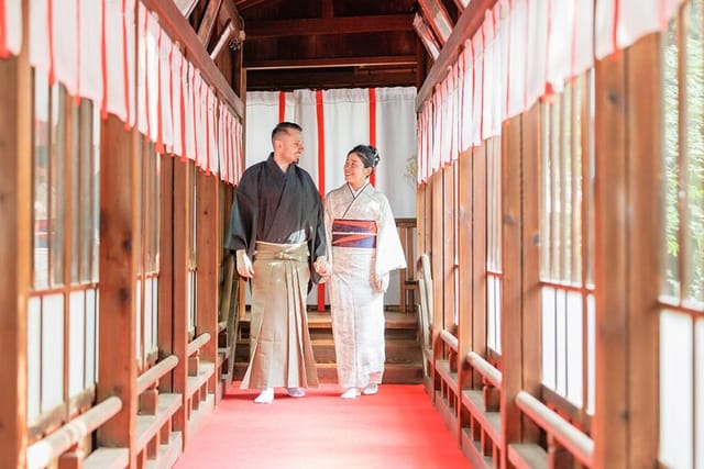 A professional Japanese photographer takes photos inside a shrine.