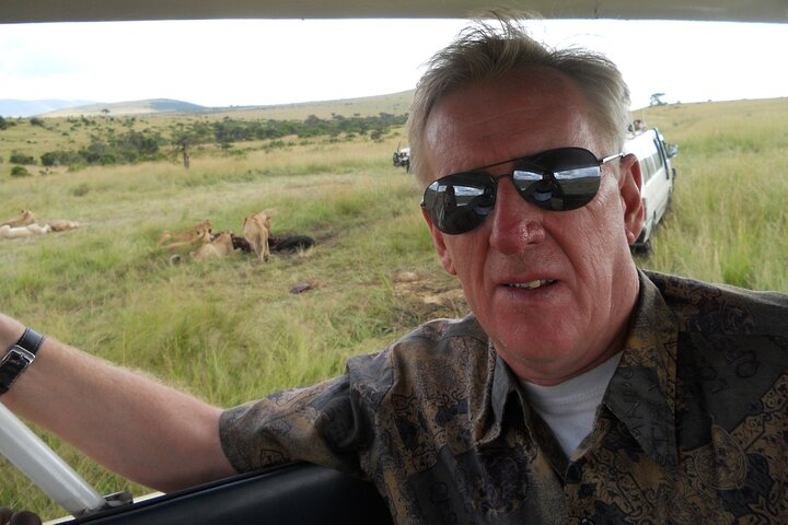 Happy Client at the Masai Mara during Game Drive.