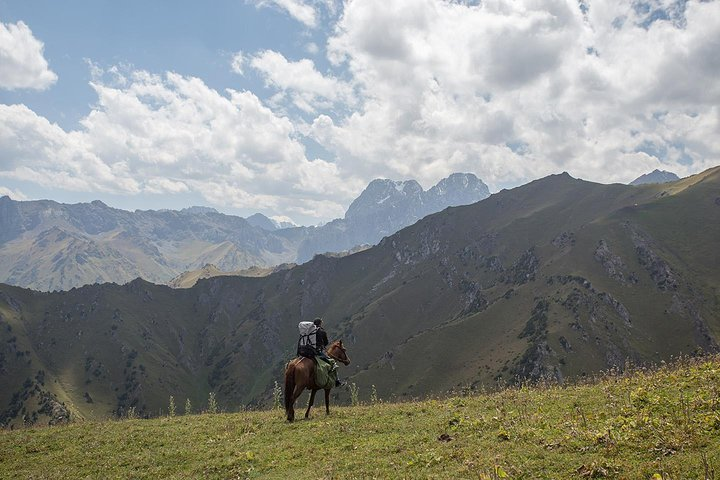 Sitting high up in the horse is the best way to explore Alay Mountains