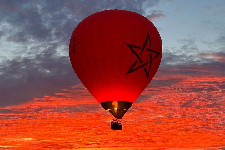 Sunrise aboard our special Moroccan flag hot air balloon