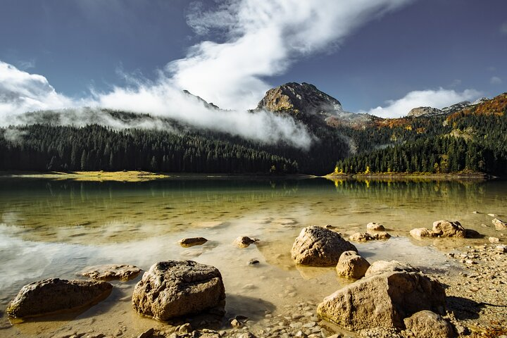 Black lake, Durmitor National Park and Bobotov Kuk - the highest mountain of Montenegro