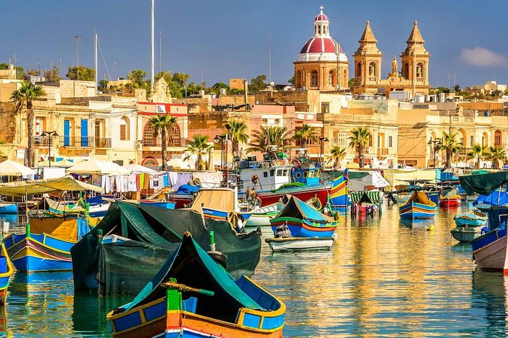 Marsaxlokk - the fishing village at the southern tip of Malta, is alive with fishing boats in the harbour, and has a bustling Sunday fish market.