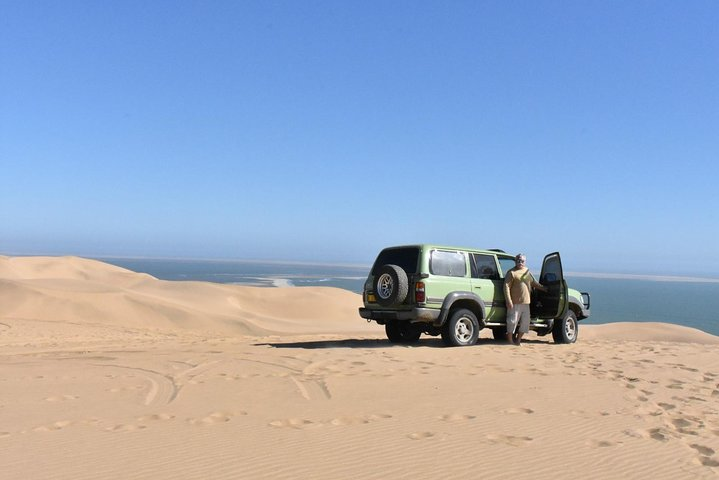 Uwe looking for a picnic spot on the towering dunes