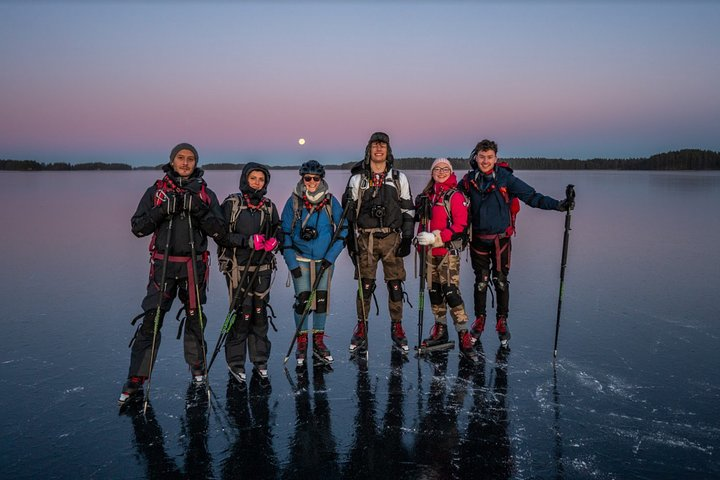 Nordic ice skating at sunset and full moon rise