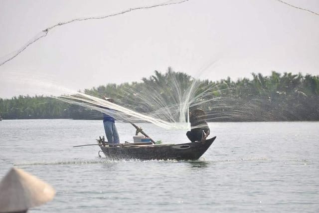 Fishing net scene at Cam Thanh Bay Mau Coconut Forest tourist spot