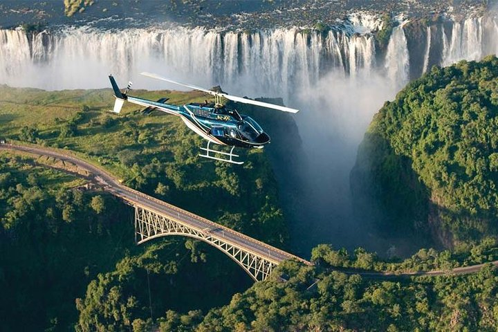 Helicopter flight with a view of the Magnificent Victoria Falls and the historical bridge 